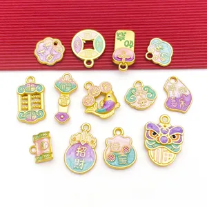 Detailed close-up of Chinese style enamel lucky charms featuring coins, fish and blessing words.