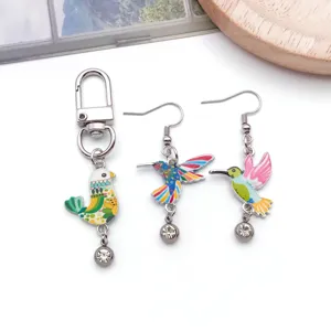 Detailed view of colorful enamel hummingbird rhinestone charm jewelry accessories closeup.