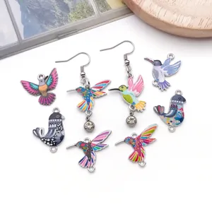 Colorful hummingbird alloy oil-drop pendant DIY jewelry accessory detail view with painted bird charms.