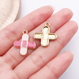 Pink band-aid enamel charm alloy DIY jewelry accessory cute medical pendant for crafting.