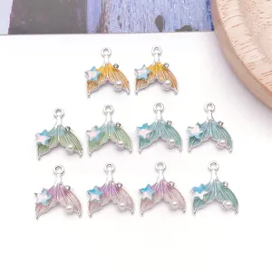 Detailed view of gradient mermaid tail alloy charms with pearls for DIY jewelry making.