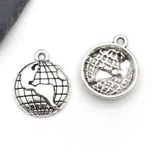 Close up detail of silver globe metal charms pendants for diy handmade necklaces and keychains.