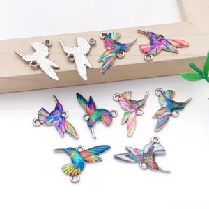 Detailed close-up of colorful enamel hummingbird double-loop charms, perfect for DIY jewelry.