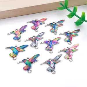 Close up of colorful enamel hummingbird alloy charms, perfect for DIY jewelry making and bracelets.