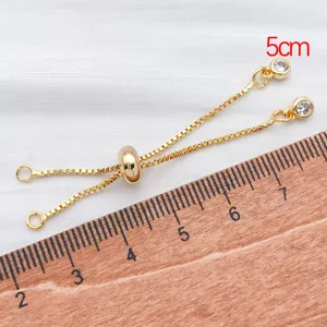 Gold plated sliding chain extender detail shot with cubic zirconia for DIY jewelry making.