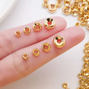 Perles d'espacement de roue à double biseau plaquées or pour la fabrication de bijoux DIY.