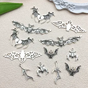 Vintage antique silver Halloween bat wings and cross charms for DIY jewelry making accessories.