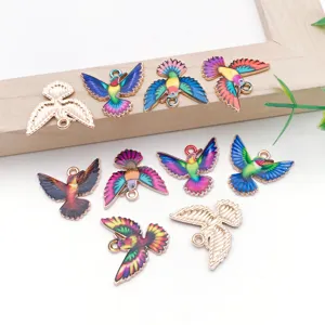 Detailed shot of colorful enamel bird charms, alloy DIY pendants for handmade jewelry and accessories.