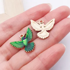 Enamel bird charm pendant detail view for DIY handmade jewelry crafting and necklace design.