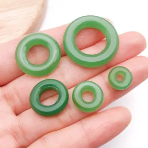 Green jade glass peace buckle loose beads detail view showing various sizes for diy jewelry.