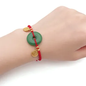 Chinese style red string green jade peace buckle bracelet with lucky gold charm accessories.