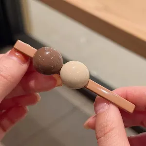 Korean style brown ball hair clip for women sweet and cool side bangs hairpin chic.
