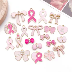 Breloques ruban cœur nœud émail rose pour fabrication de bijoux DIY accessoires.