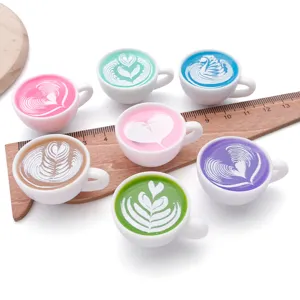 Miniature resin coffee cup charms with cute latte art design for DIY jewelry making accessories.