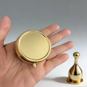 Portatile mini scatola per pillole rotonda in metallo specchio tascabile colore oro lucido.