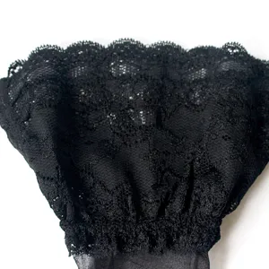 Black lace thigh high stockings detail view, featuring exquisite floral trim and mesh.