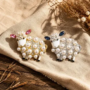 Exquisite pearl and rhinestone sheep brooch detail showing delicate crystal ears and sparkle.