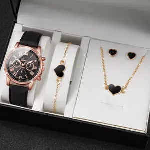 Vista dettagliata dell'elegante set regalo con orologio al quarzo in oro rosa e gioielli.
