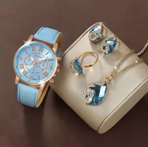 Elegante set di gioielli con orologio blu a goccia e un cinturino in pelle molto alla moda.