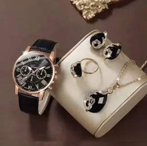 Elegante orologio nero e set di gioielli in cristallo con collana, anello e orecchini.