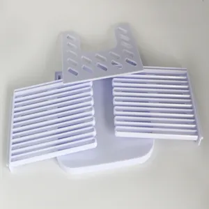 Bread slicer detail view, white plastic toast cutting guide, DIY cake slice tool for kitchen.