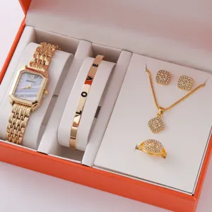 Elegant gold square quartz watch set featuring crystal LOVE bangle, necklace, and earrings.