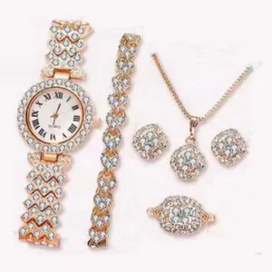 Luxury rhinestone watch and jewelry set for women with sparkling crystals in rose gold.