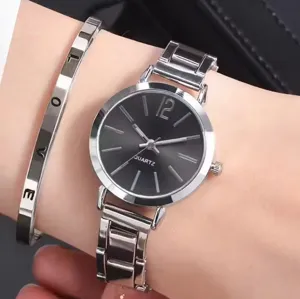 Stunning women quartz watch and matching metal bracelet set with elegant black dial.