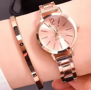 Rose gold quartz watch and love bracelet set detail wrist display, fashion women jewelry accessory.