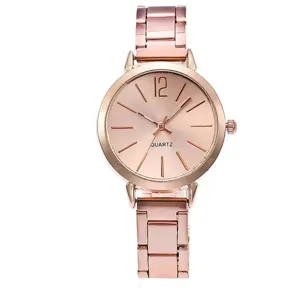 Women rose gold quartz watch with metal link bracelet and minimalist dial numbers and markers.