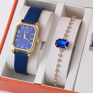Women's quartz watch and rhinestone crystal bracelet gift set with blue dial and strap.