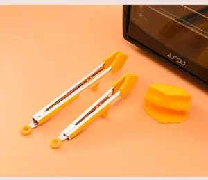 Pince de cuisine en acier inoxydable avec embouts en silicone et mini gant pour cuisiner.