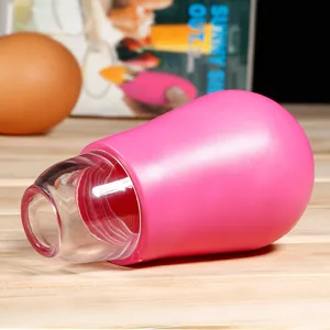 Silicone egg yolk separator detail view, kitchen baking tool for easy egg white filtering.