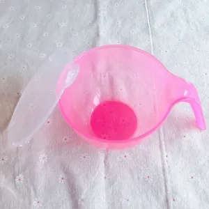 Pink translucent baking mixing bowl with lid, perfect for cake frosting and cream coloring.
