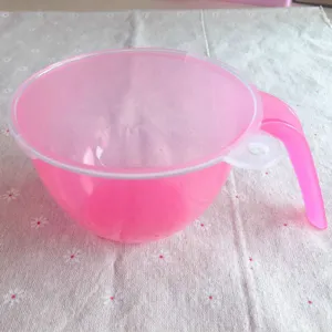 Pink plastic baking mixing bowl with lid and handle for frosting and cake decoration