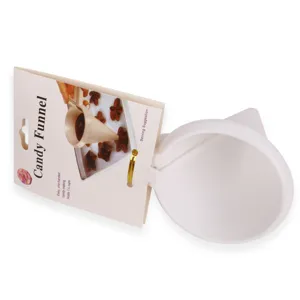 Close-up detail shot of white plastic candy funnel with packaging tag for easy baking tasks.
