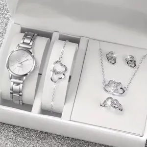 Detailed shot of the elegant silver quartz watch and heart shaped jewelry gift set.