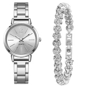 Detailed view of the silver quartz watch and heart-shaped rhinestone bracelet set close up.