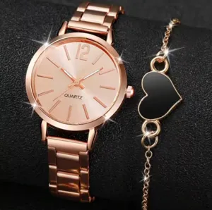 Elegant rose gold quartz watch and fashionable black heart bracelet set for women.