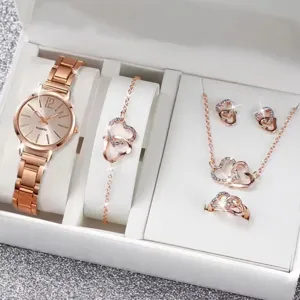 Rose gold watch and heart jewelry set detail, featuring sparkling rhinestones and design.
