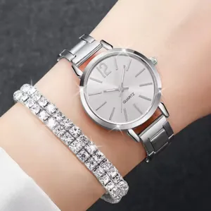 Exquisite women's quartz watch and sparkling rhinestone bracelet set, silver tone design.