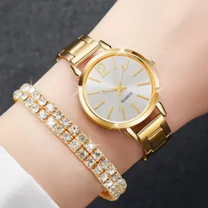 Gold tone quartz watch with double rhinestone tennis bracelet set for women, detail wrist view.