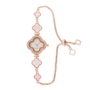 Rose gold quartz watch with mother of pearl clover dial and adjustable chain bracelet.