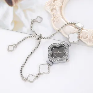 Details of a women quartz watch with clover shape dial, rhinestone bezel and bracelet.