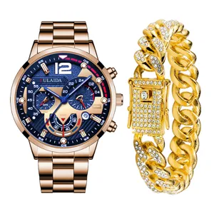 Set orologio al quarzo da uomo cinturino acciaio quadrante blu e catena cubana con strass.