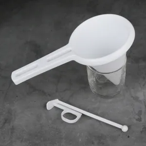 Handheld plastic cream funnel dispenser tool for cupcakes chocolate baking and pastry decorating.