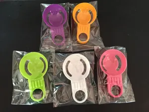 Close-up view of colorful plastic egg white separators in individual clear packaging.