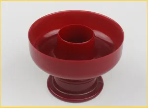 Red plastic hollow cake baking mold detail view, perfect for making pastries and donuts.