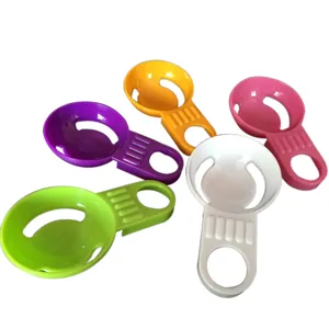 Plastic egg white and yolk separator, multi-color kitchen baking tool with short handle.