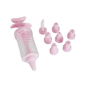Roze koekjespers met 8 spuitmondjes voor het bakken van heerlijke koekjes en gebak.